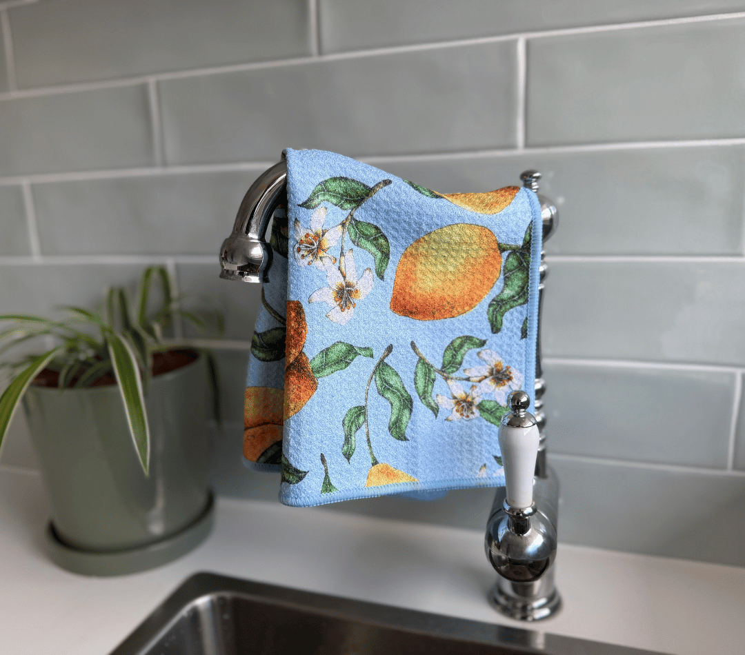 DirtyGirl Lemon Twist Cloth draped over sink tap – Absorbent weave for spills