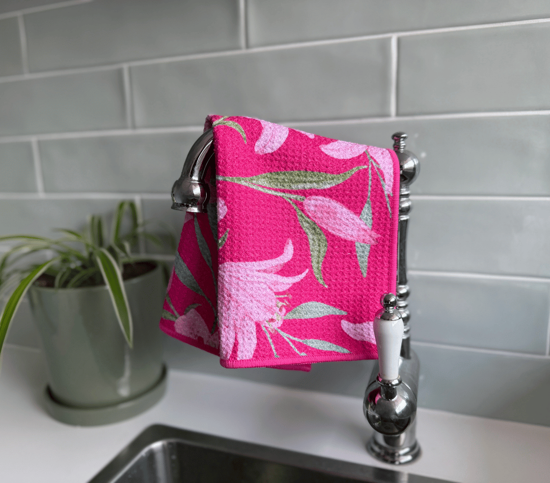 DirtyGirl Lily Blush Cloth draped over sink tap – Absorbent weave for spills